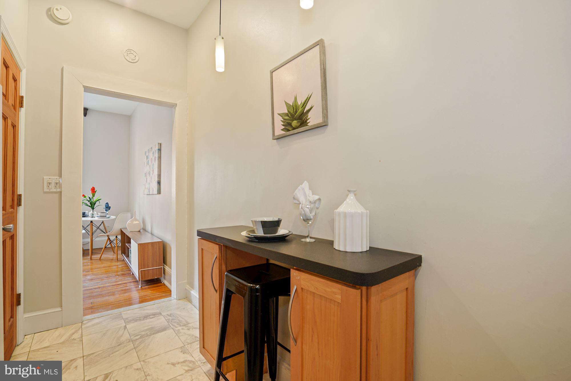 1322 15th Street Northwest, Unit 3 Washington, DC 20005 - Photo 14 of 16 a dining room with table and chairs