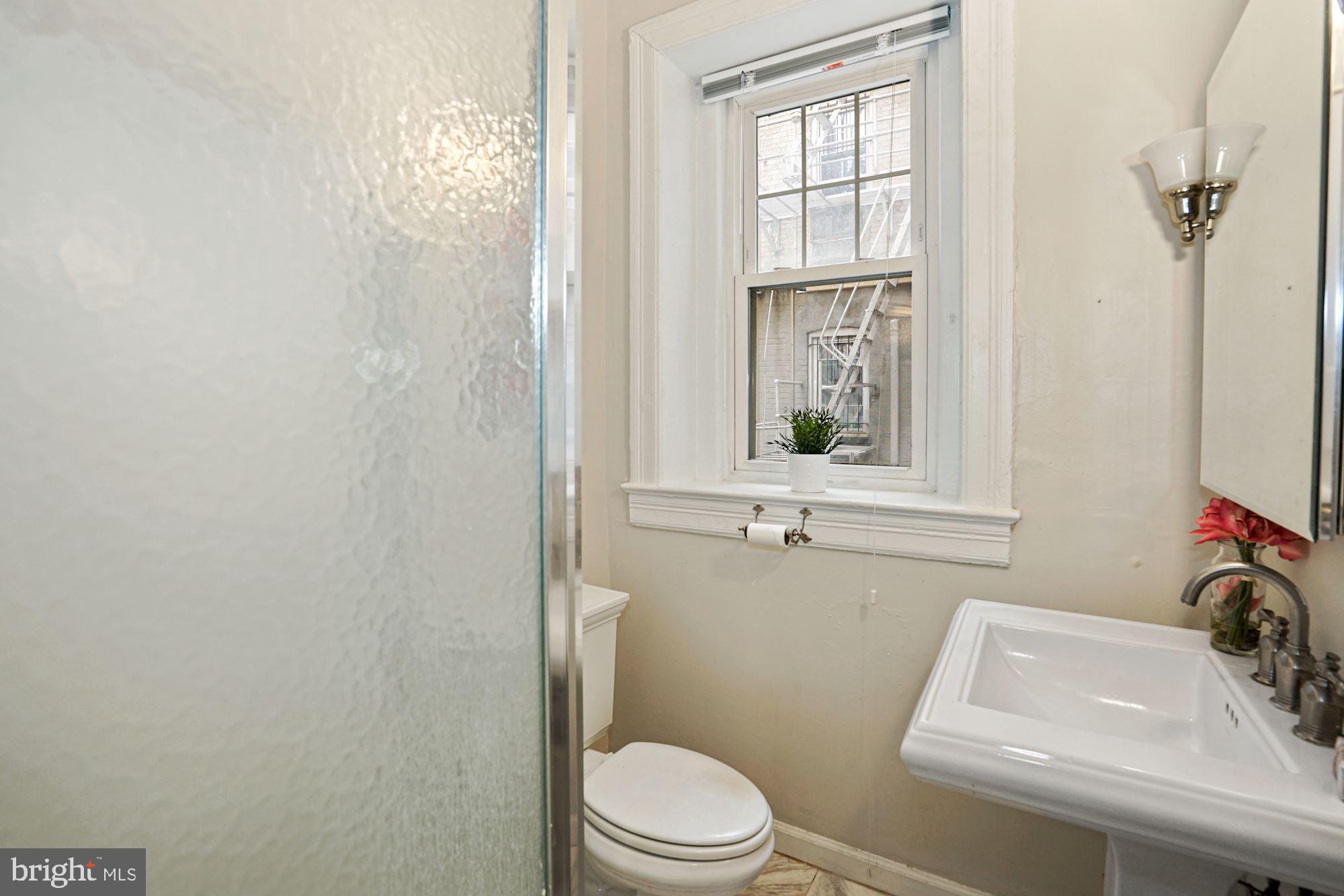 1322 15th Street Northwest, Unit 3 Washington, DC 20005 - Photo 15 of 16 a bathroom with a sink and a toilet