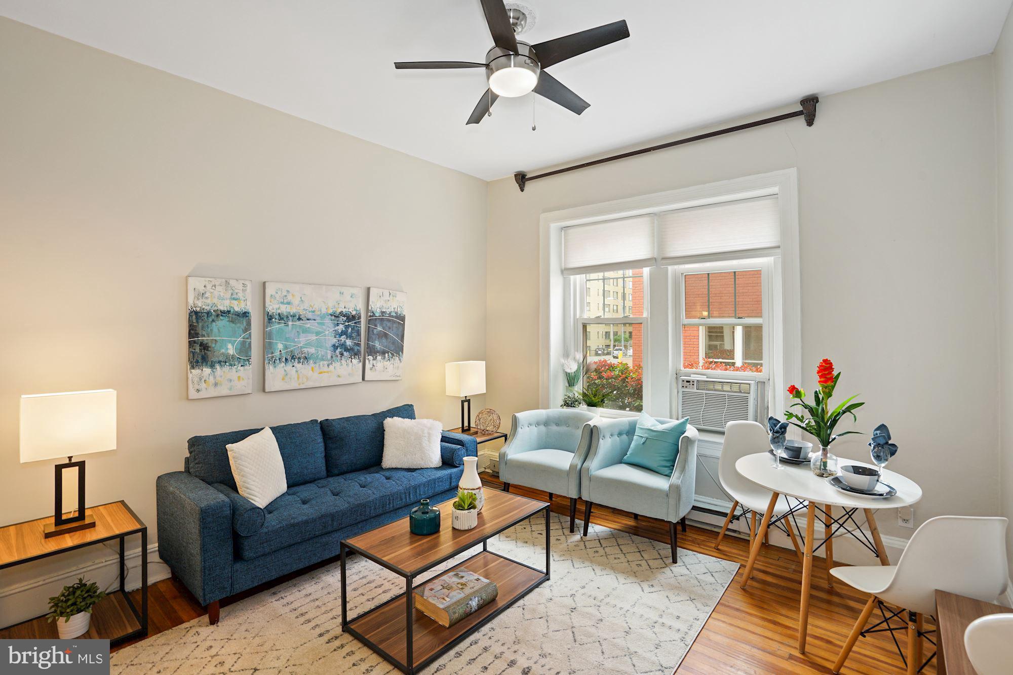 1322 15th Street Northwest, Unit 3 Washington, DC 20005 - Photo 7 of 16 a living room with furniture and a large window