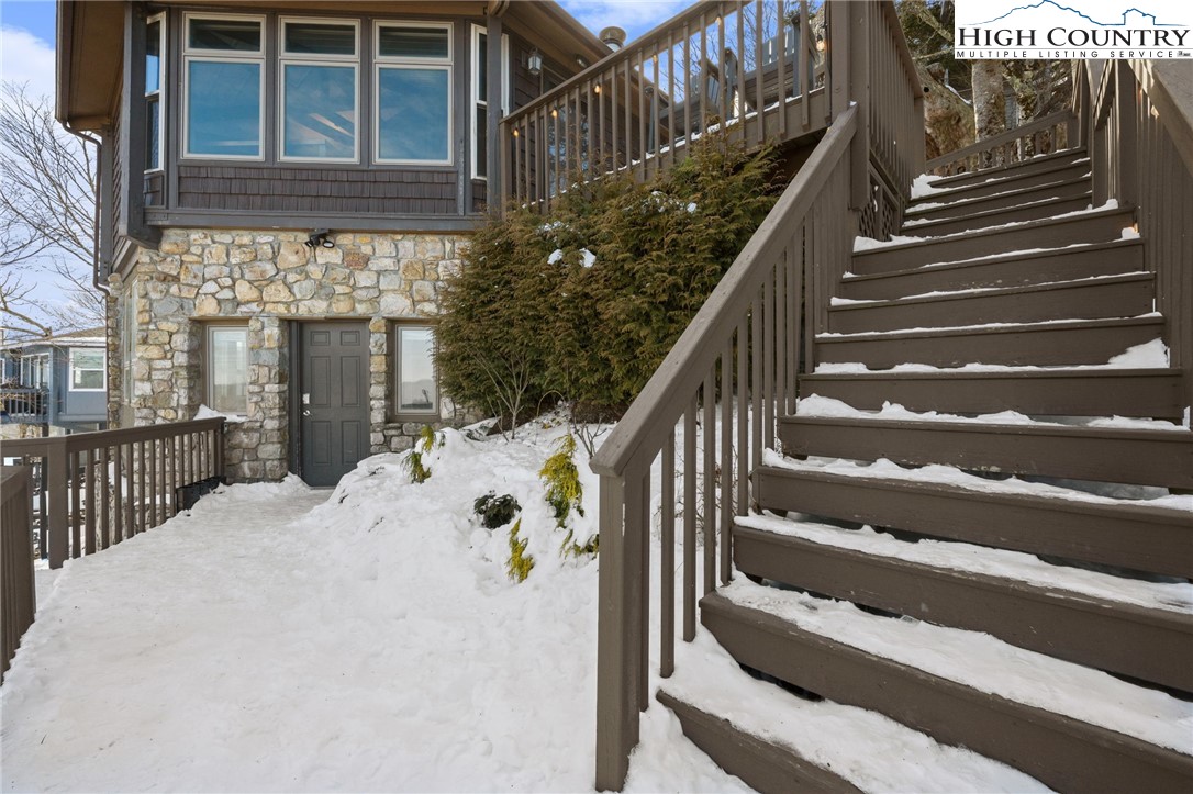 109 Skiloft Road Beech Mountain, NC 28604 - Photo 29 of 30 a view of entryway with wooden floor and front door