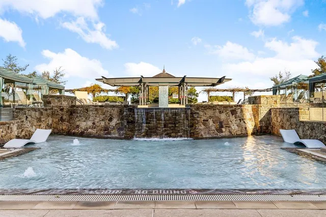 a outdoor space with patio furniture and a fireplace
