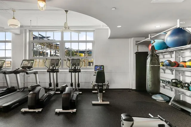 a view of a patio with couches table and chairs and potted plants