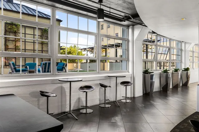 a lobby with furniture and fireplace