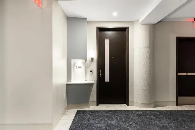 an empty room with mirror