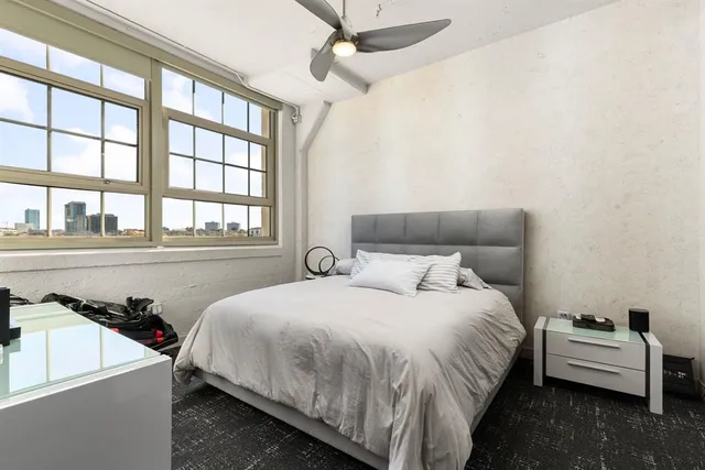 a bedroom with a bed and a couch