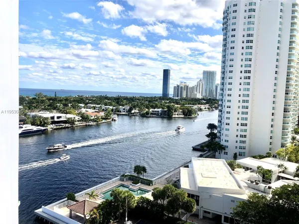 a view of a lake with tall buildings