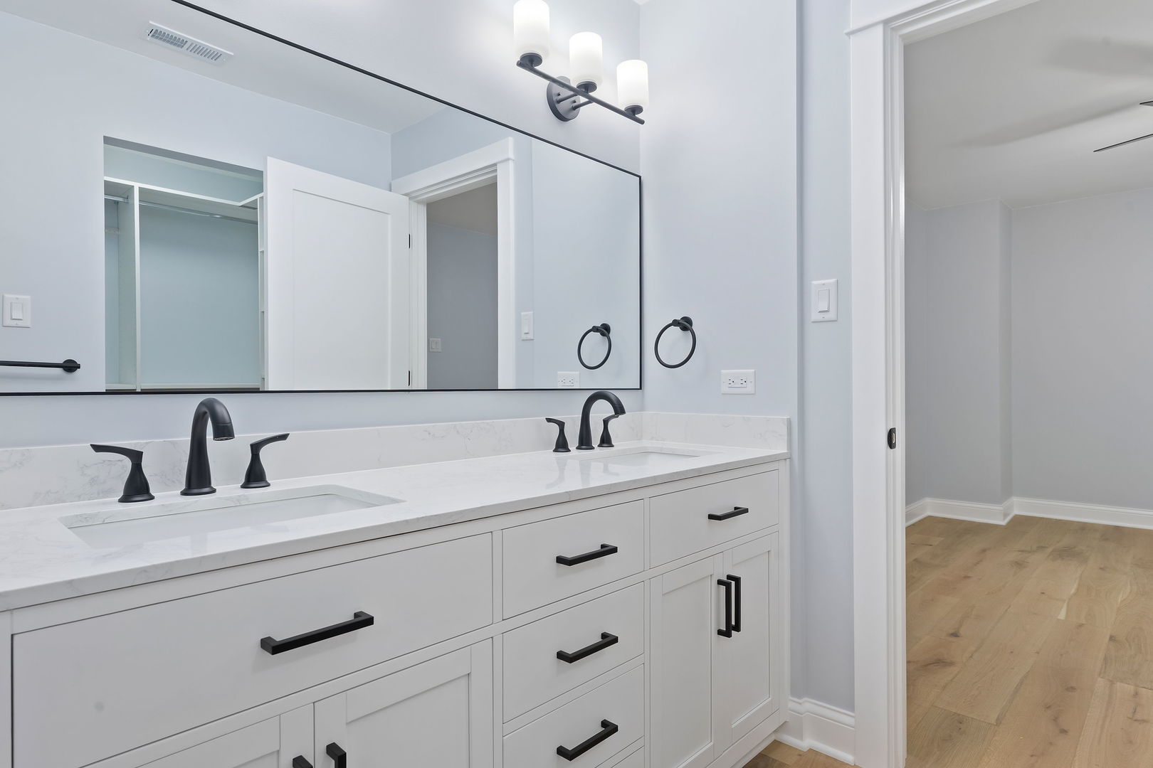 1615 North Vine Street Chicago, IL 60614 - Photo 15 of 25 a bathroom with a double vanity sink and a mirror