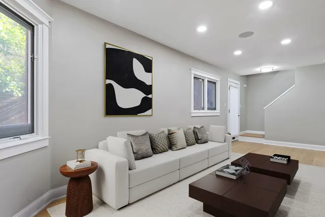 a living room with furniture and a window