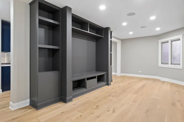 an empty room with wooden floor