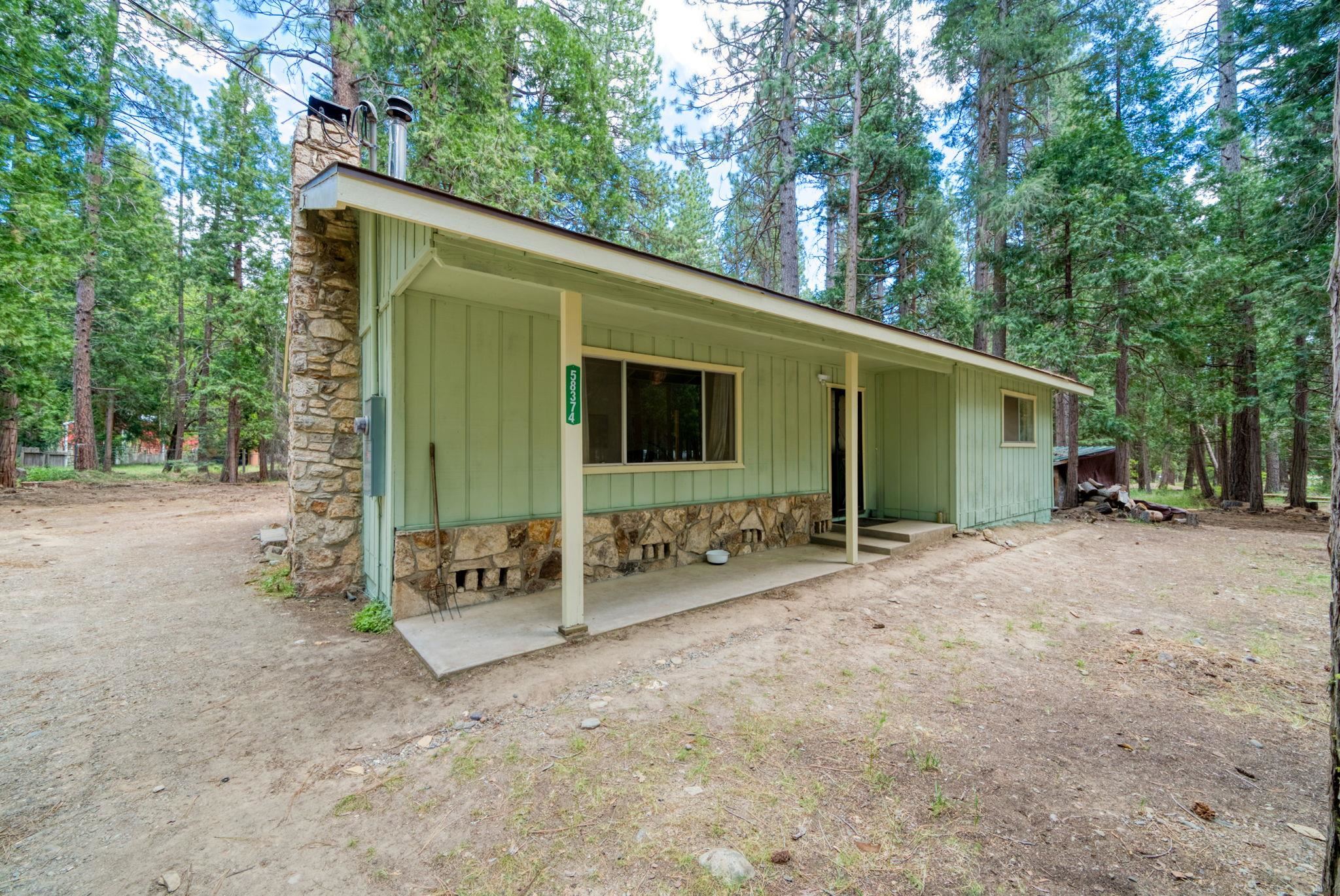 58374 Gill Ranch Road Cromberg, CA 96103 - Photo 8 of 44 a view of a house with backyard and trees