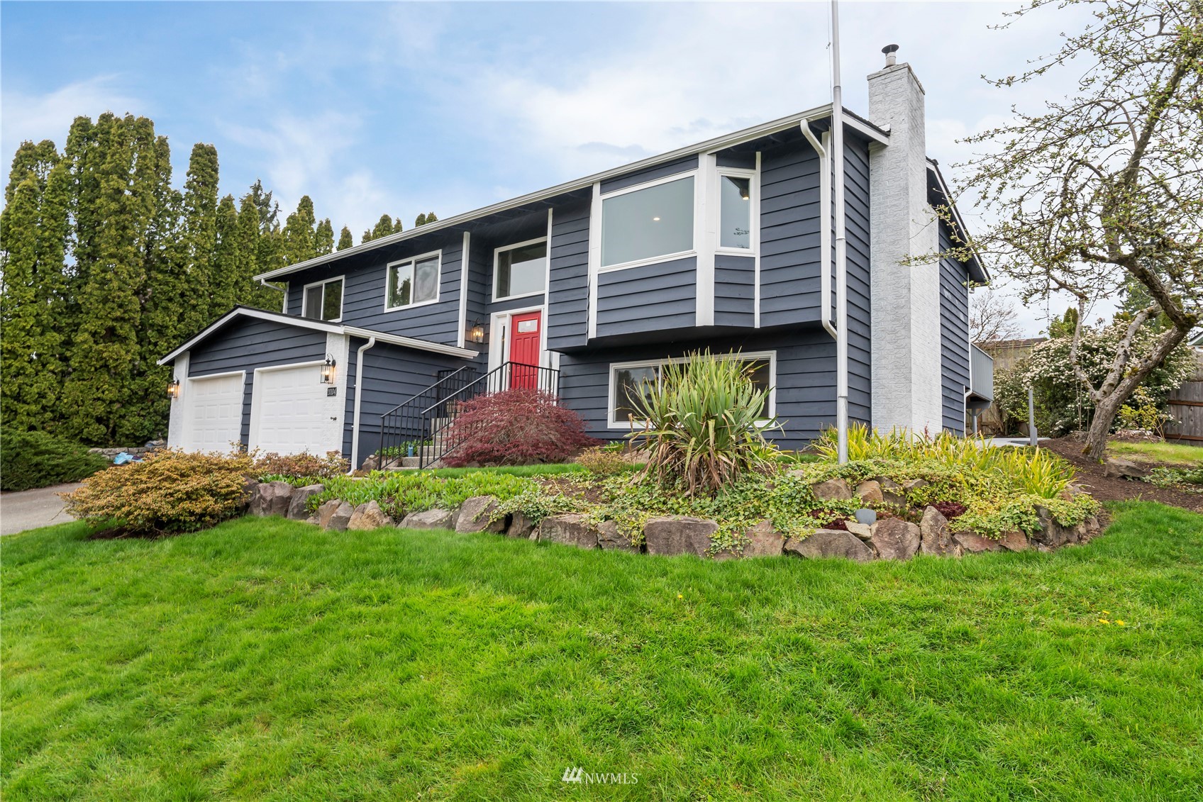 20104 103rd Place Northeast Bothell, WA 98011 - Photo 1 of 40 a front view of a house with garden