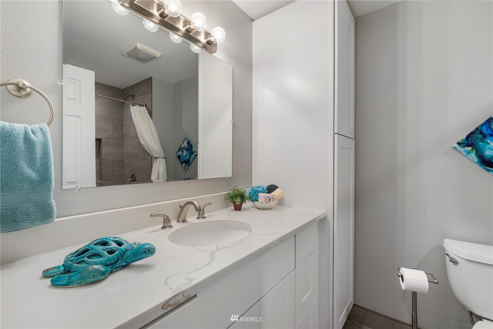 20104 103rd Place Northeast Bothell, WA 98011 - Photo 24 of 40 a bathroom with a granite countertop sink a toilet and a mirror