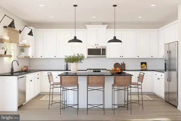 a kitchen with stainless steel appliances granite countertop a sink a stove a refrigerator and chairs