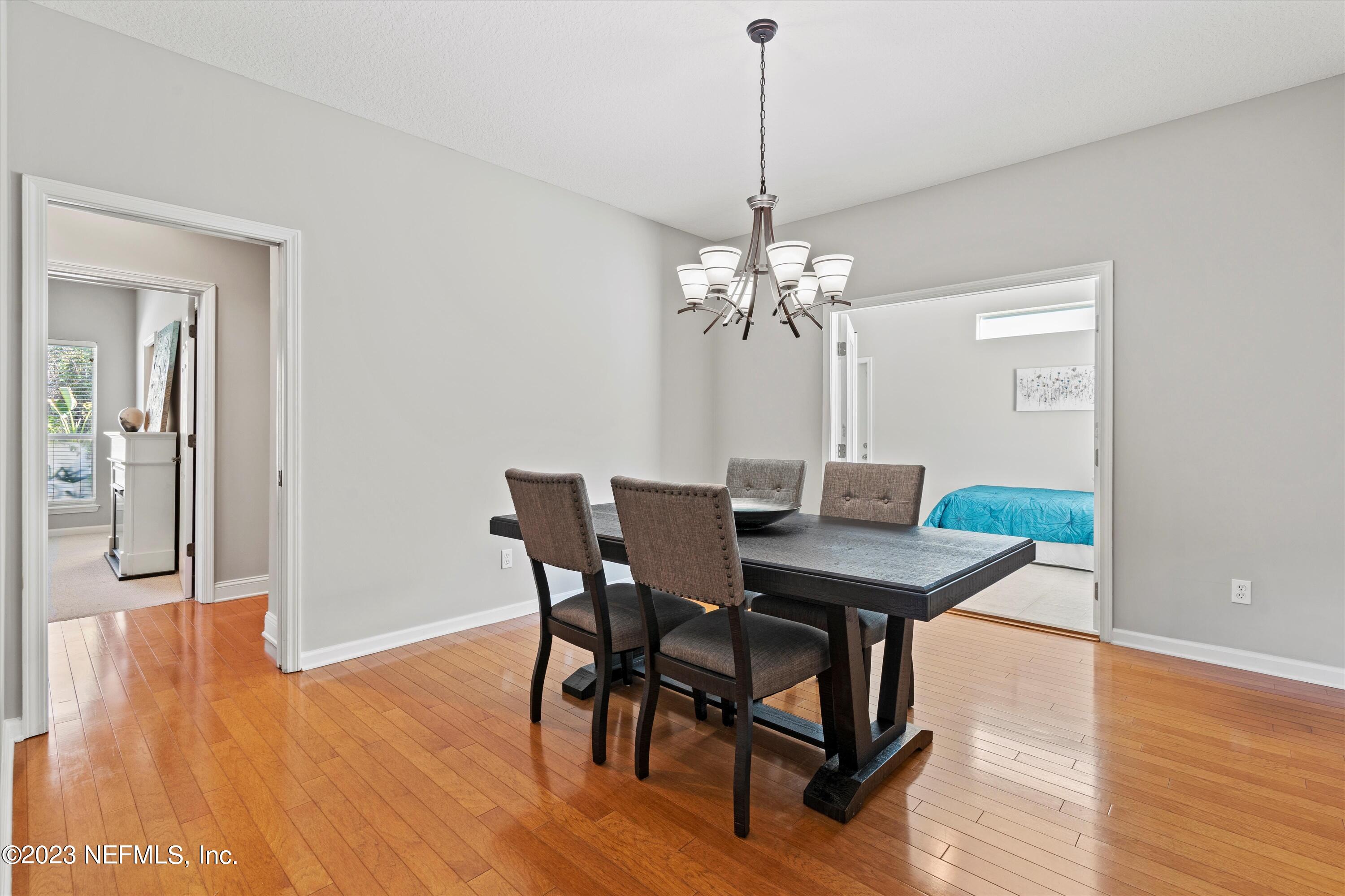 618 Racoon Court St. Johns, FL 32259 - Photo 12 of 61 a view of a dining room with furniture and wooden floor