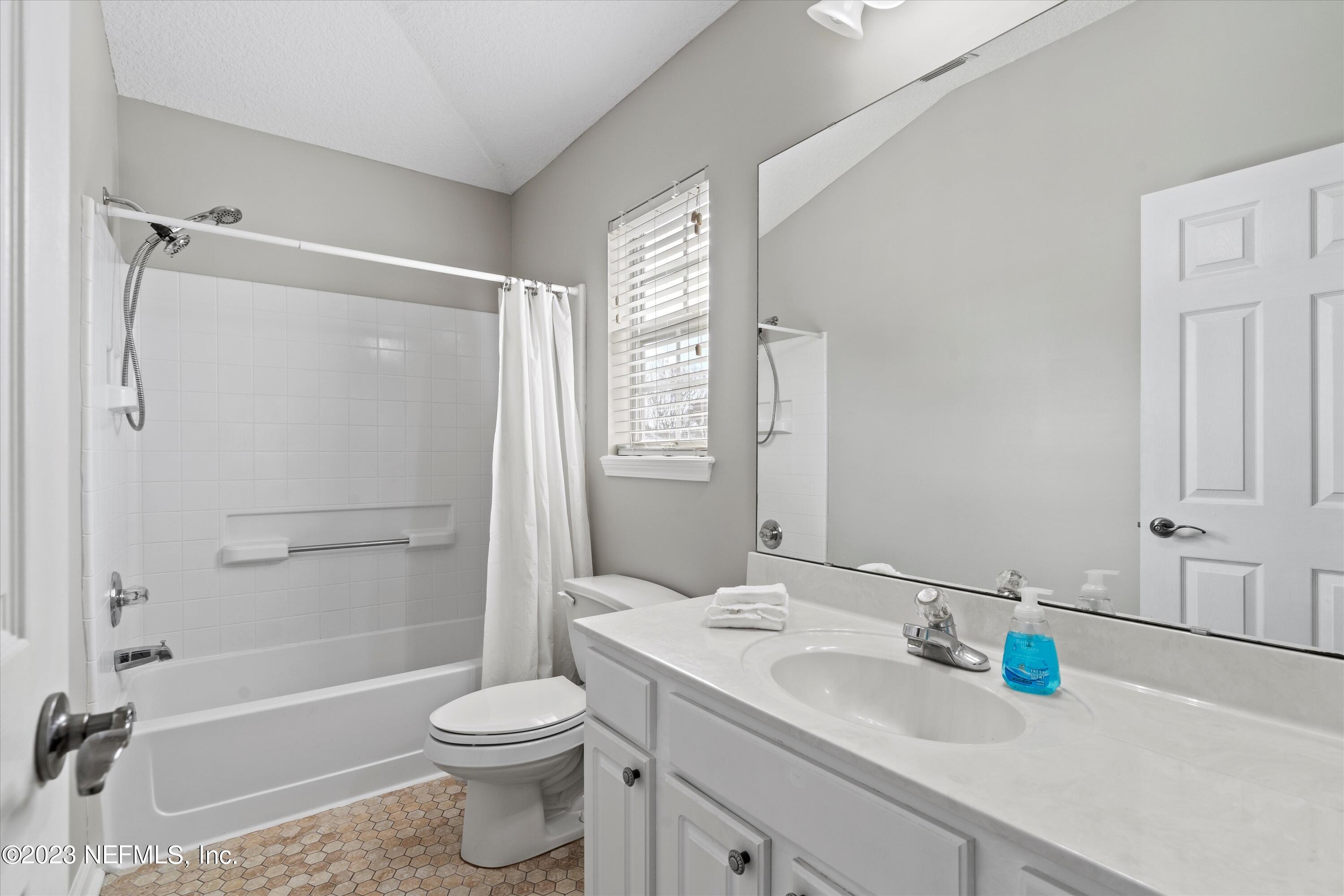 618 Racoon Court St. Johns, FL 32259 - Photo 24 of 61 a bathroom with a sink toilet and shower