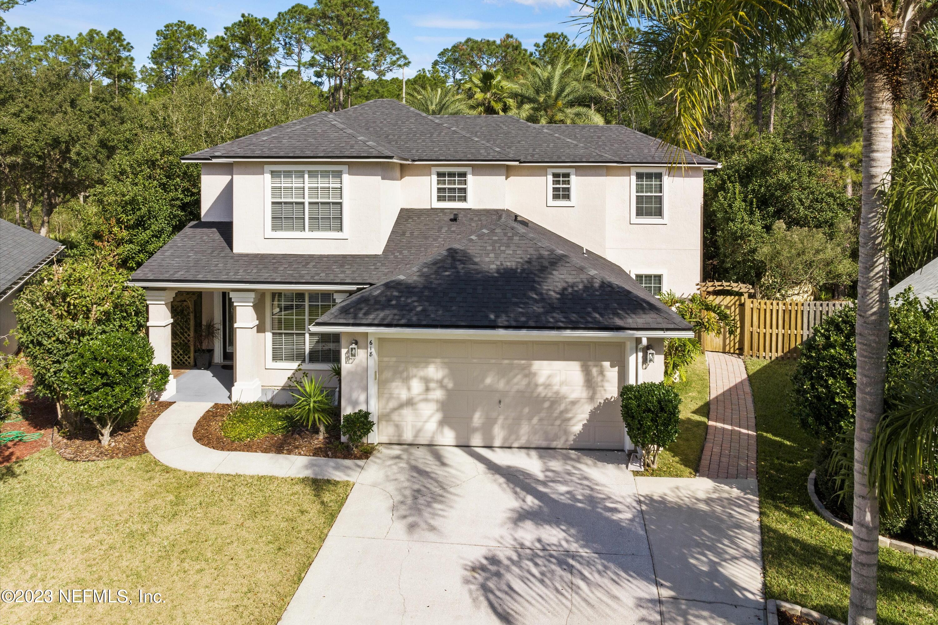 618 Racoon Court St. Johns, FL 32259 - Photo 4 of 61 a front view of a house with garden