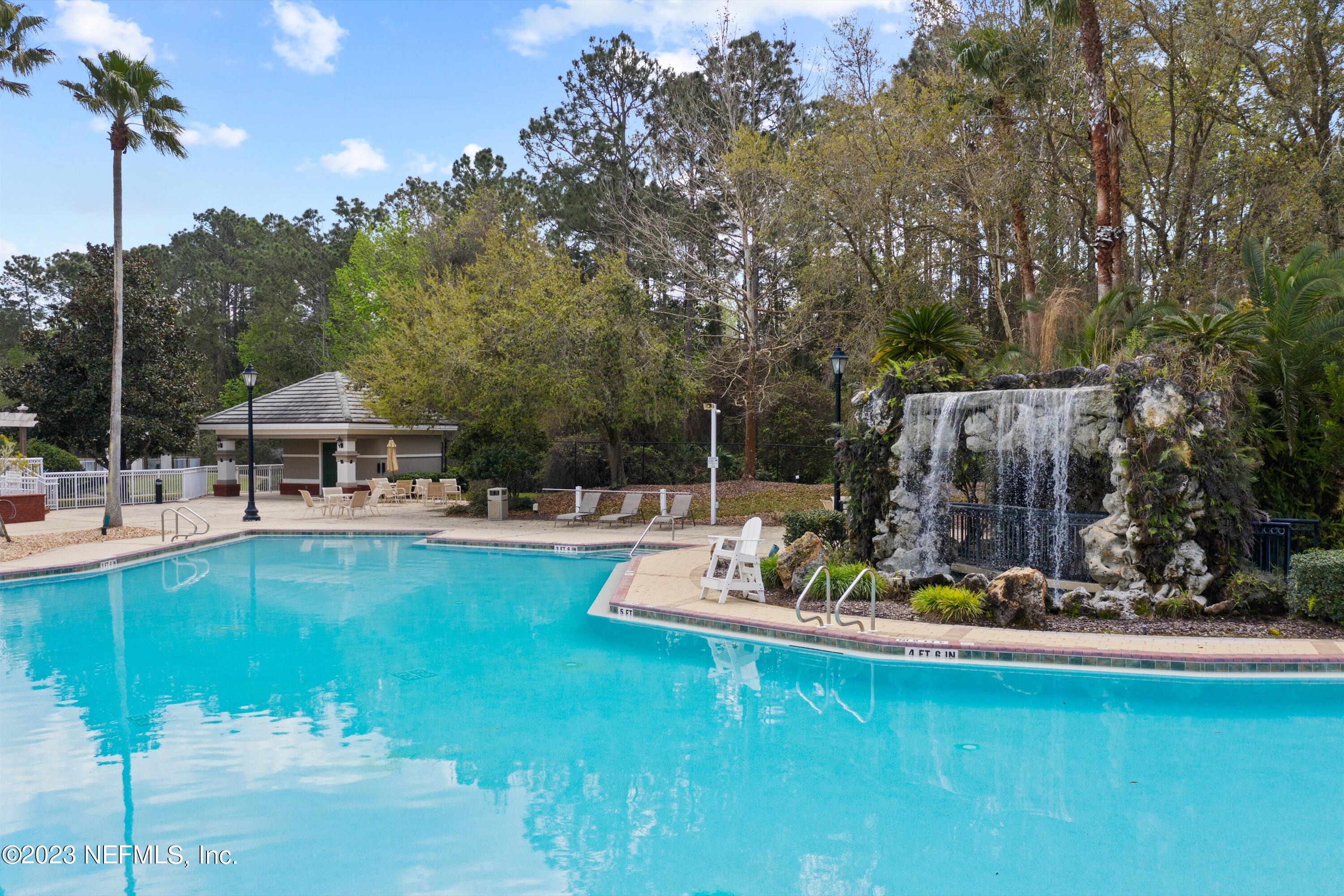 618 Racoon Court St. Johns, FL 32259 - Photo 54 of 61 a view of a swimming pool with a patio and a garden