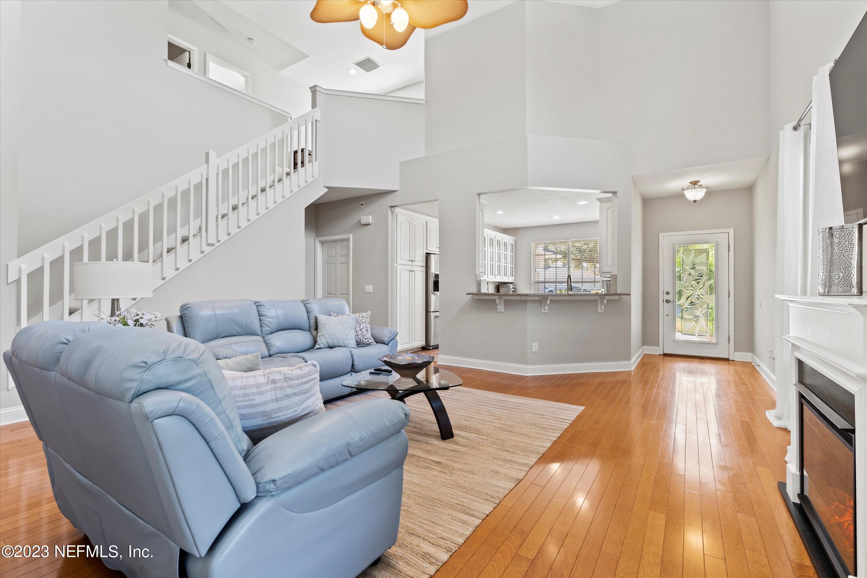 618 Racoon Court St. Johns, FL 32259 - Photo 7 of 61 a living room with furniture and a wooden floor