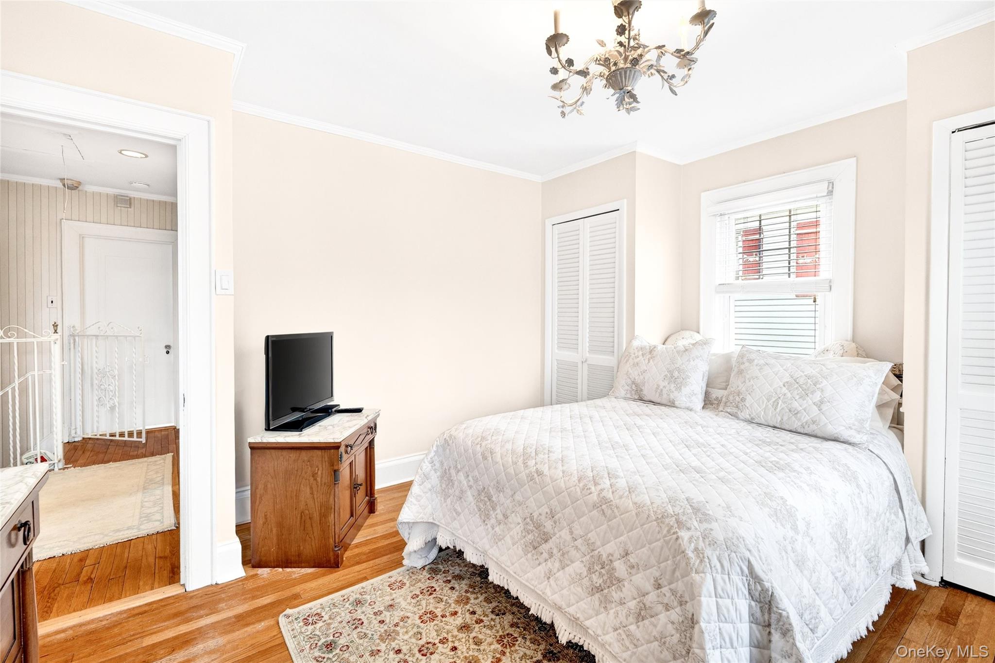 3334 Country Club Road Bronx, NY 10465 - Photo 32 of 48 a bedroom with a bed and a television