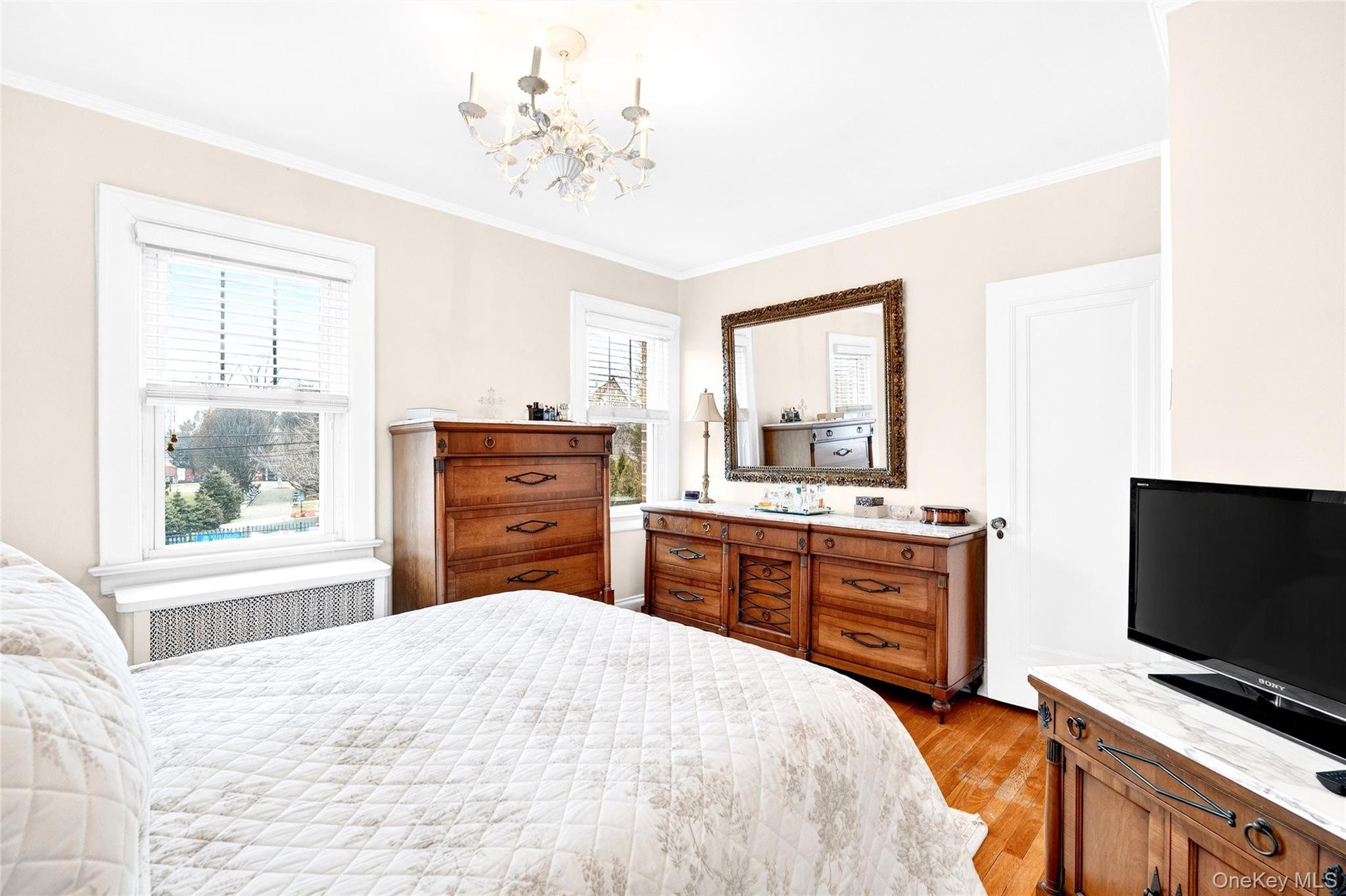 3334 Country Club Road Bronx, NY 10465 - Photo 33 of 48 a bedroom with a bed and a flat screen tv