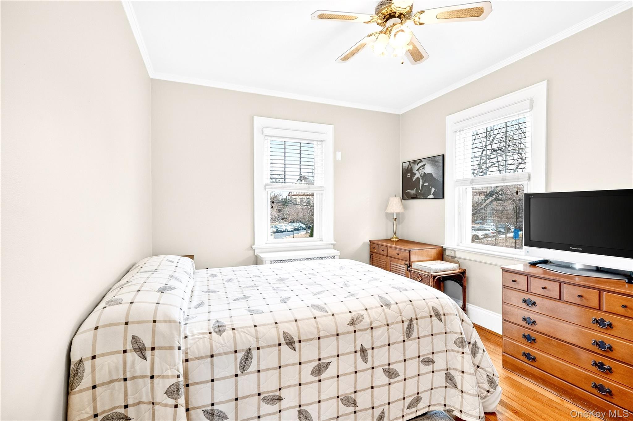 3334 Country Club Road Bronx, NY 10465 - Photo 35 of 48 a bedroom with a bed and a flat screen tv