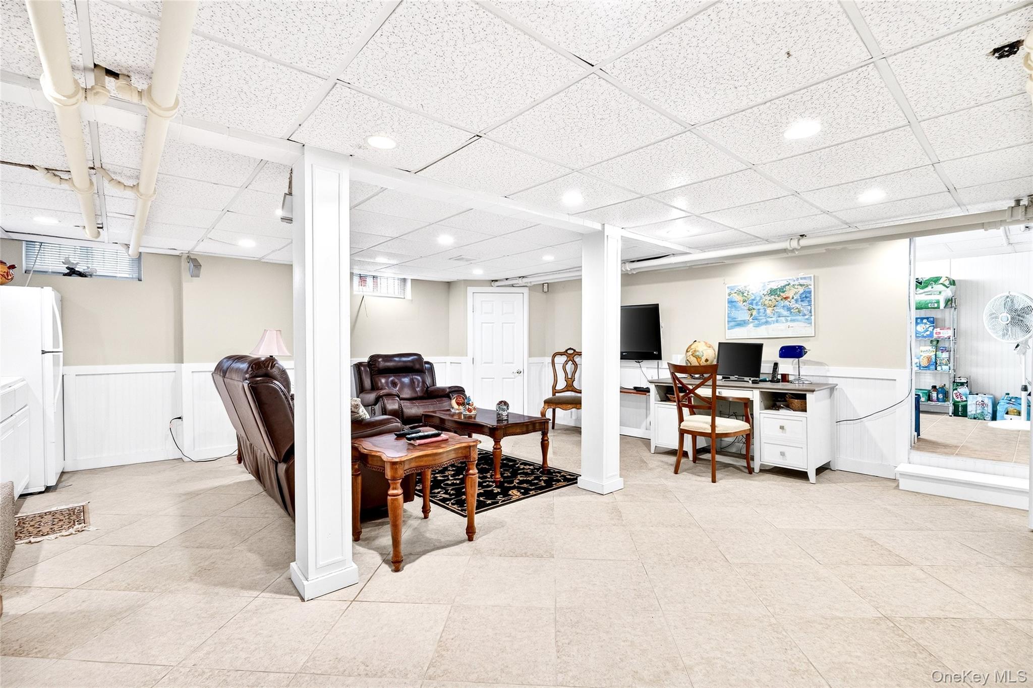 3334 Country Club Road Bronx, NY 10465 - Photo 40 of 48 a living room with furniture a computer on a desk and chair