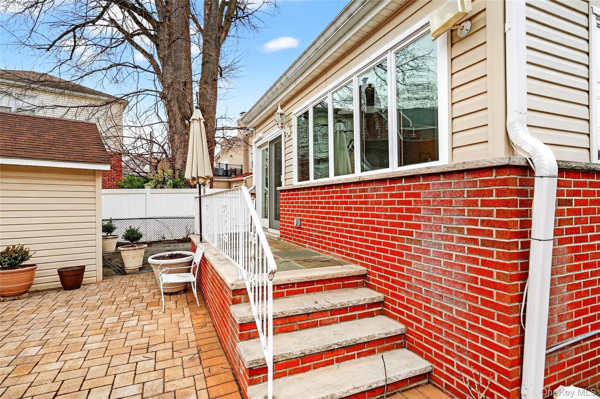 3334 Country Club Road Bronx, NY 10465 - Photo 45 of 48 a view of a patio with a table and chairs