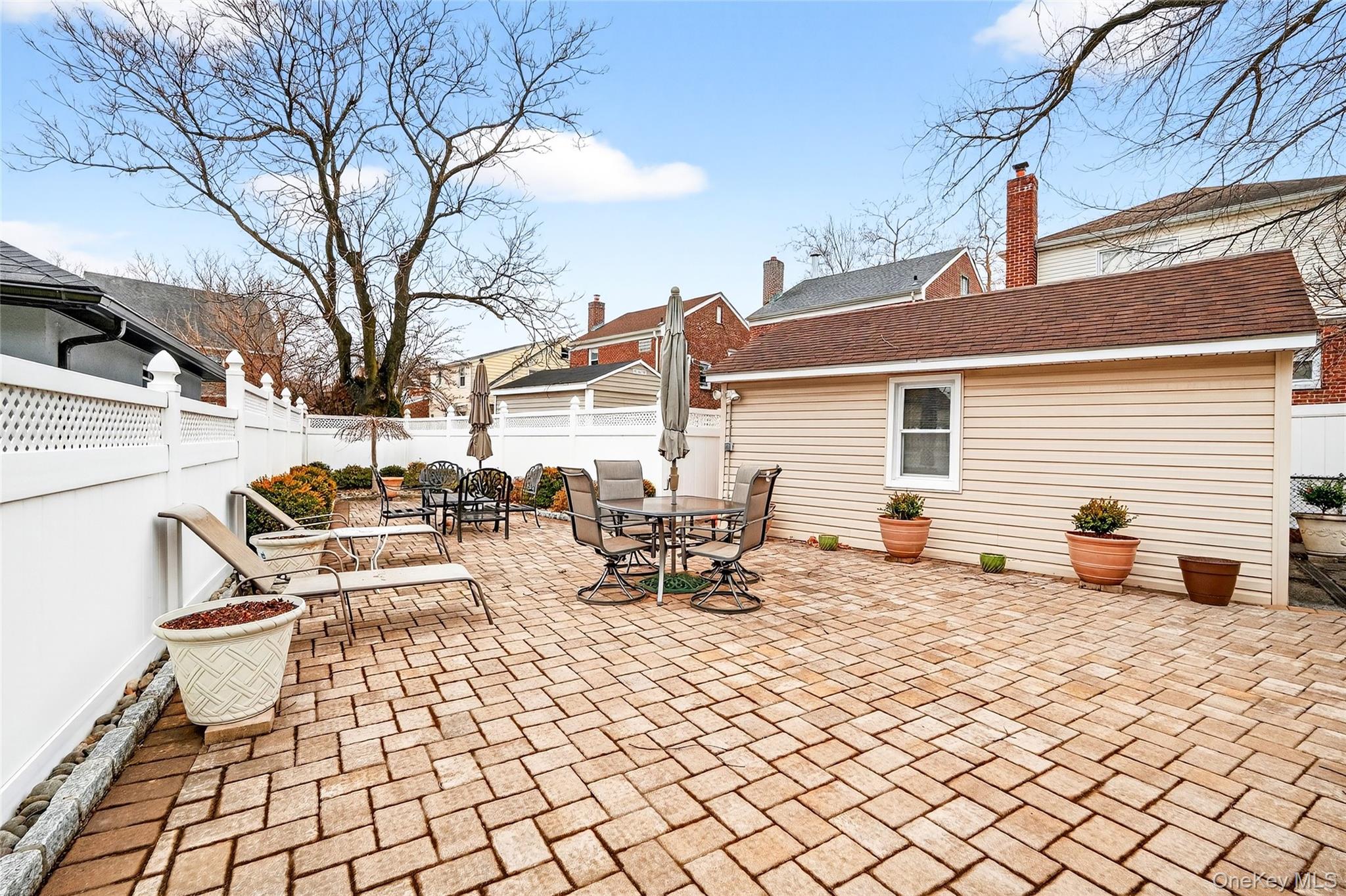 3334 Country Club Road Bronx, NY 10465 - Photo 48 of 48 a view of a terrace with chairs and wooden fence