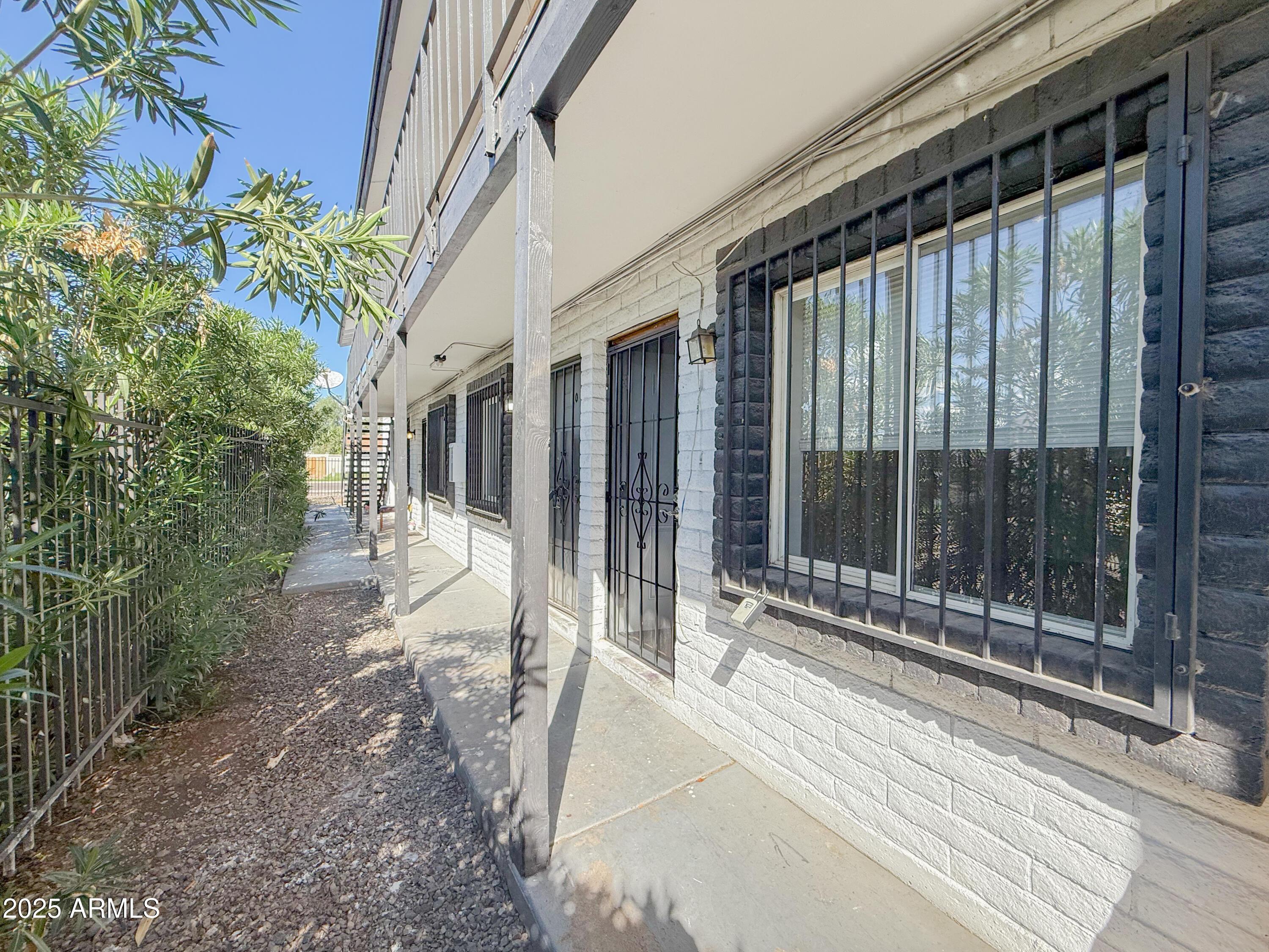 1703 West Mountain View Road, Unit 13 Phoenix, AZ 85021 - Photo 3 of 12 a view of a house with a garden