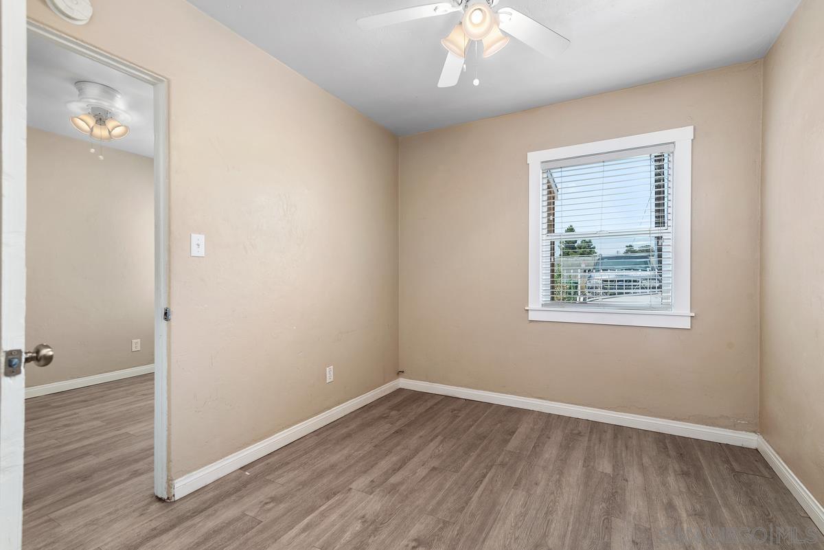 3378 B Street San Diego, CA 92102 - Photo 11 of 27 an empty room with wooden floor and windows