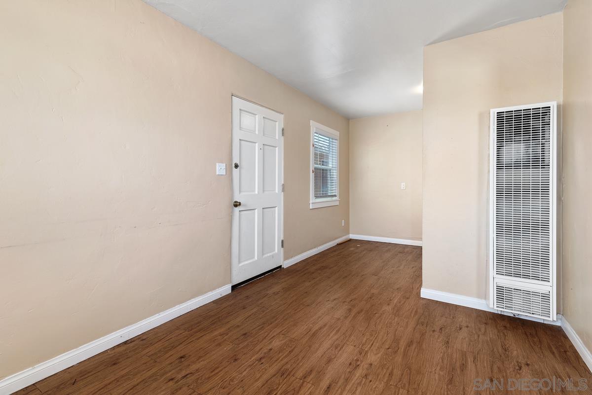 3378 B Street San Diego, CA 92102 - Photo 16 of 27 a view of an empty room with wooden floor and entryway
