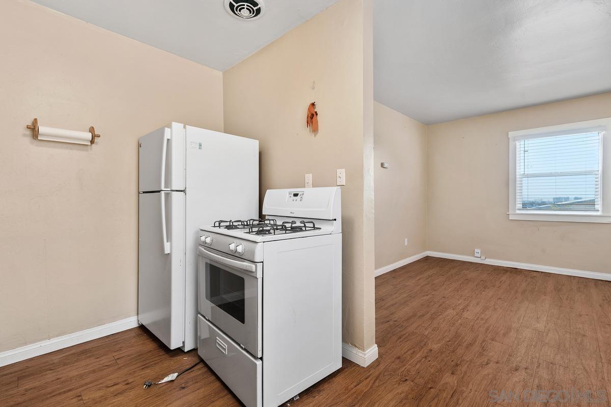 3378 B Street San Diego, CA 92102 - Photo 20 of 27 a kitchen with a stove a refrigerator and a microwave