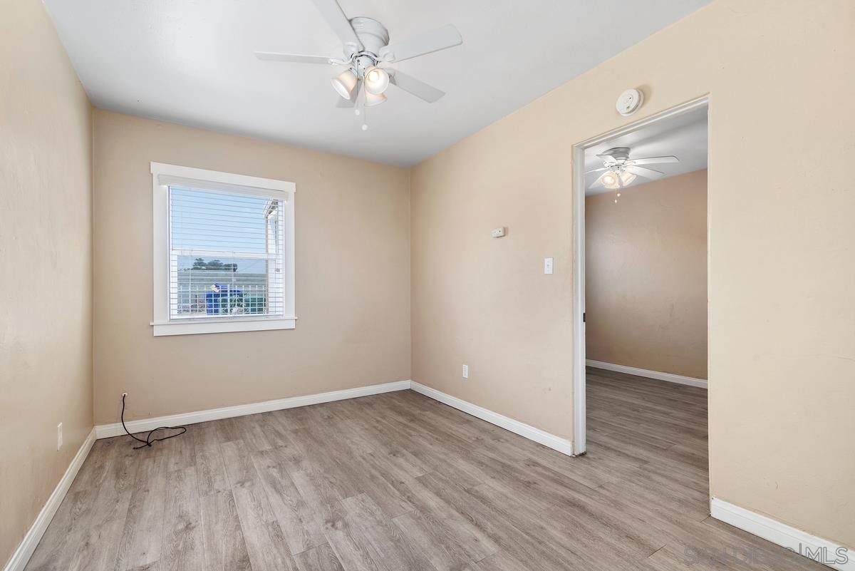 3378 B Street San Diego, CA 92102 - Photo 2 of 27 wooden floor in an empty room with a window
