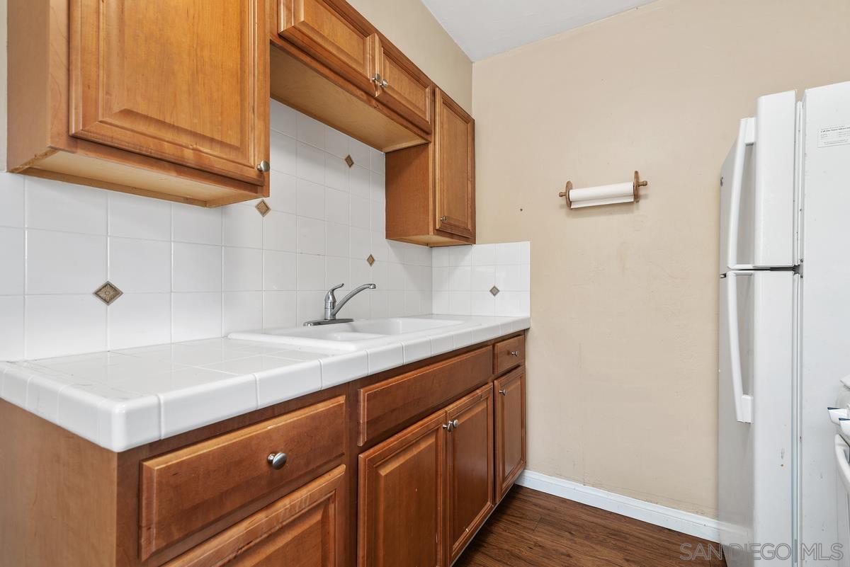 3378 B Street San Diego, CA 92102 - Photo 21 of 27 a kitchen with a sink and a refrigerator