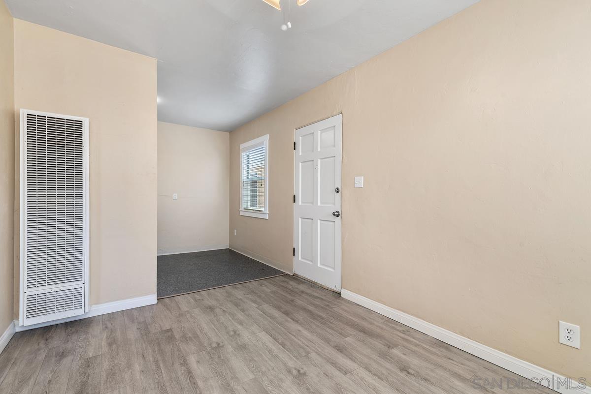 3378 B Street San Diego, CA 92102 - Photo 4 of 27 an empty room with wooden floor and windows
