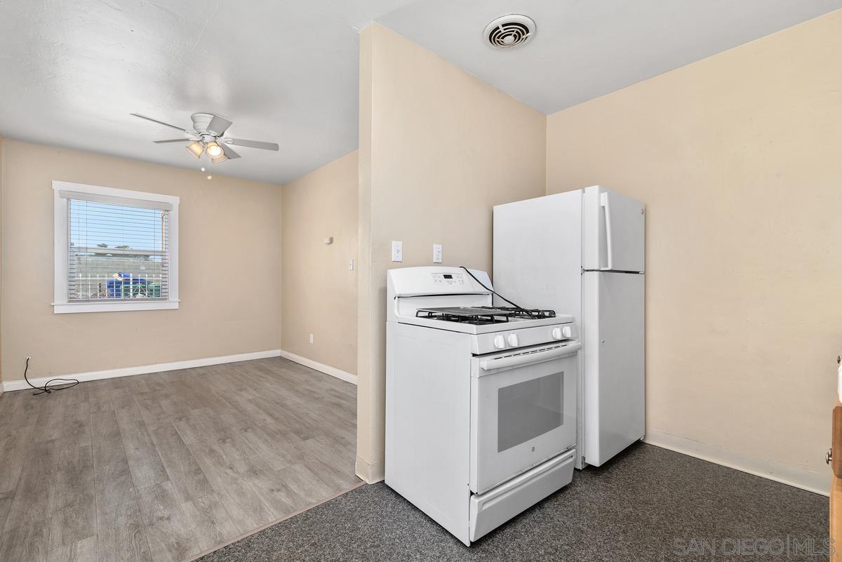 3378 B Street San Diego, CA 92102 - Photo 6 of 27 a view of a kitchen with cabinets and stainless steel appliances