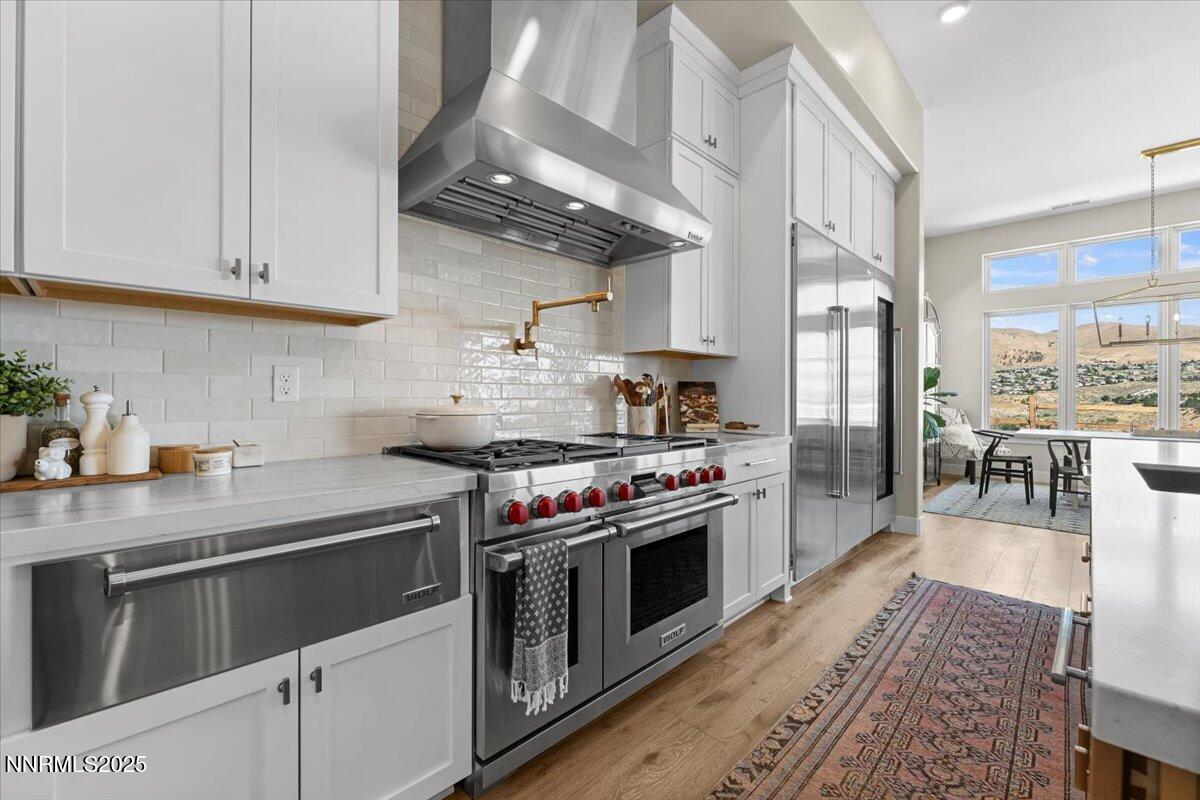 1593 River Hill Way Reno, NV 89523 - Photo 11 of 63 a kitchen with stainless steel appliances granite countertop a stove a refrigerator and a sink