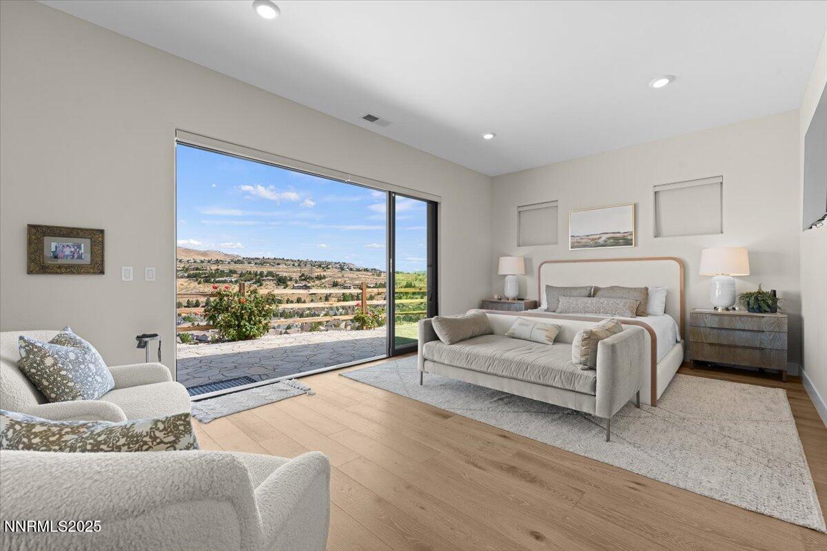 1593 River Hill Way Reno, NV 89523 - Photo 15 of 63 a spacious bedroom with a large bed and a large window