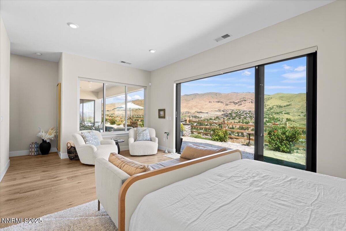 1593 River Hill Way Reno, NV 89523 - Photo 17 of 63 a bedroom with a large bed and a large window