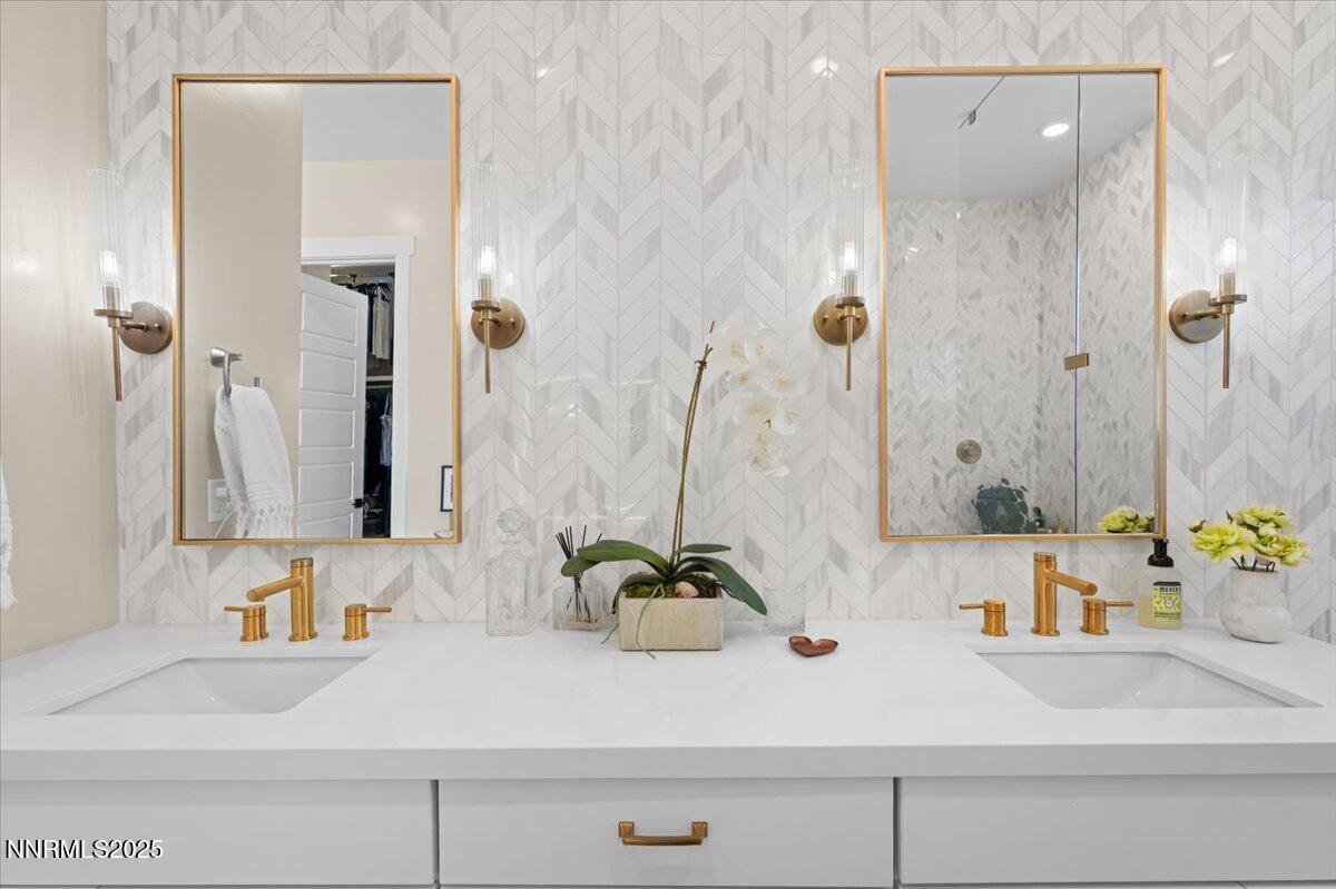 1593 River Hill Way Reno, NV 89523 - Photo 19 of 63 a bathroom with a sink and a mirror