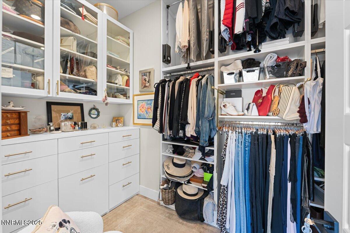 1593 River Hill Way Reno, NV 89523 - Photo 20 of 63 a view of walk in closet with clothes and shoes