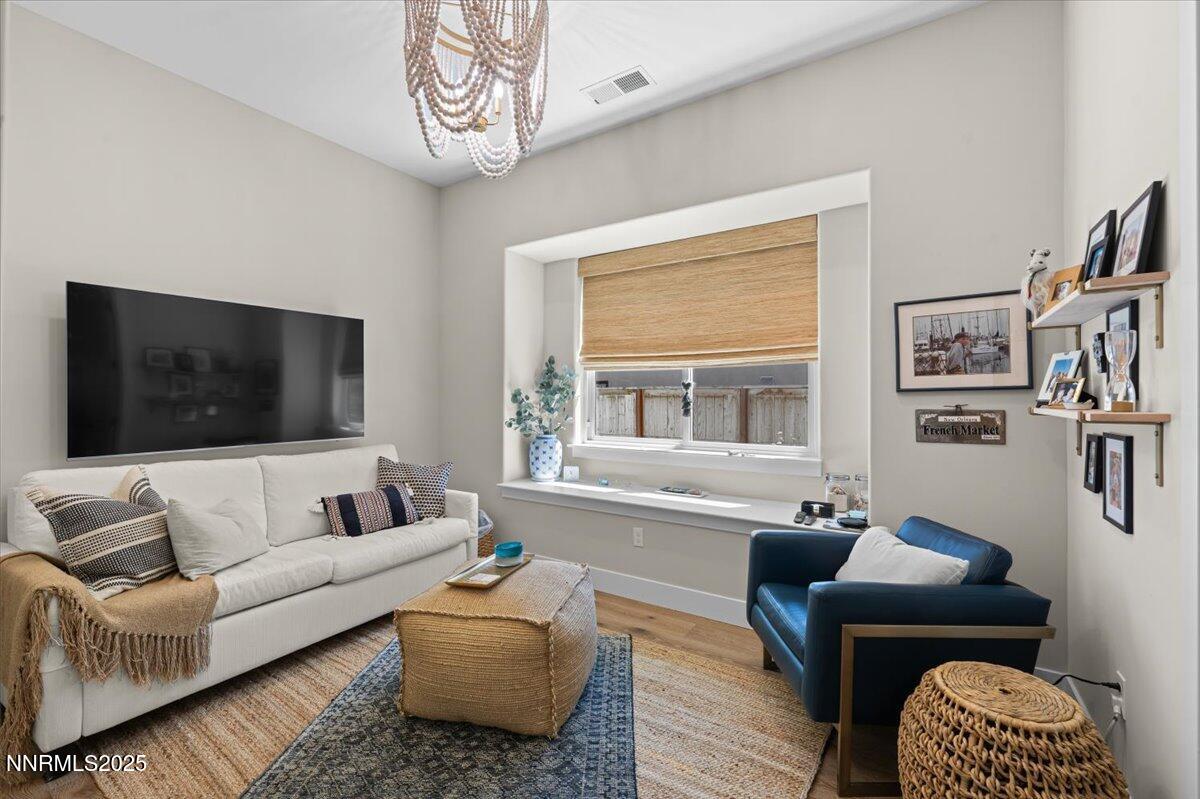 1593 River Hill Way Reno, NV 89523 - Photo 21 of 63 a living room with furniture and a flat screen tv