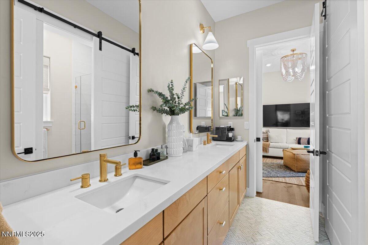 1593 River Hill Way Reno, NV 89523 - Photo 23 of 63 a bathroom with a double vanity sink and mirror