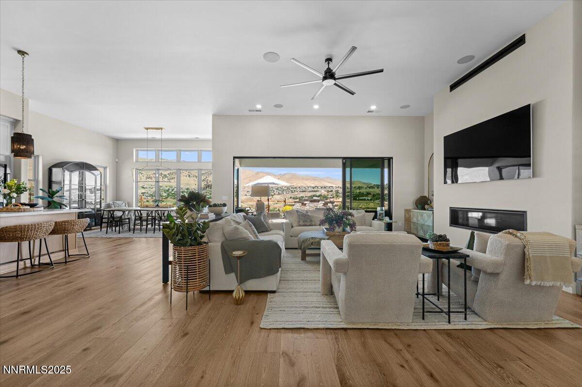 1593 River Hill Way Reno, NV 89523 - Photo 4 of 63 a living room with fireplace furniture and a flat screen tv