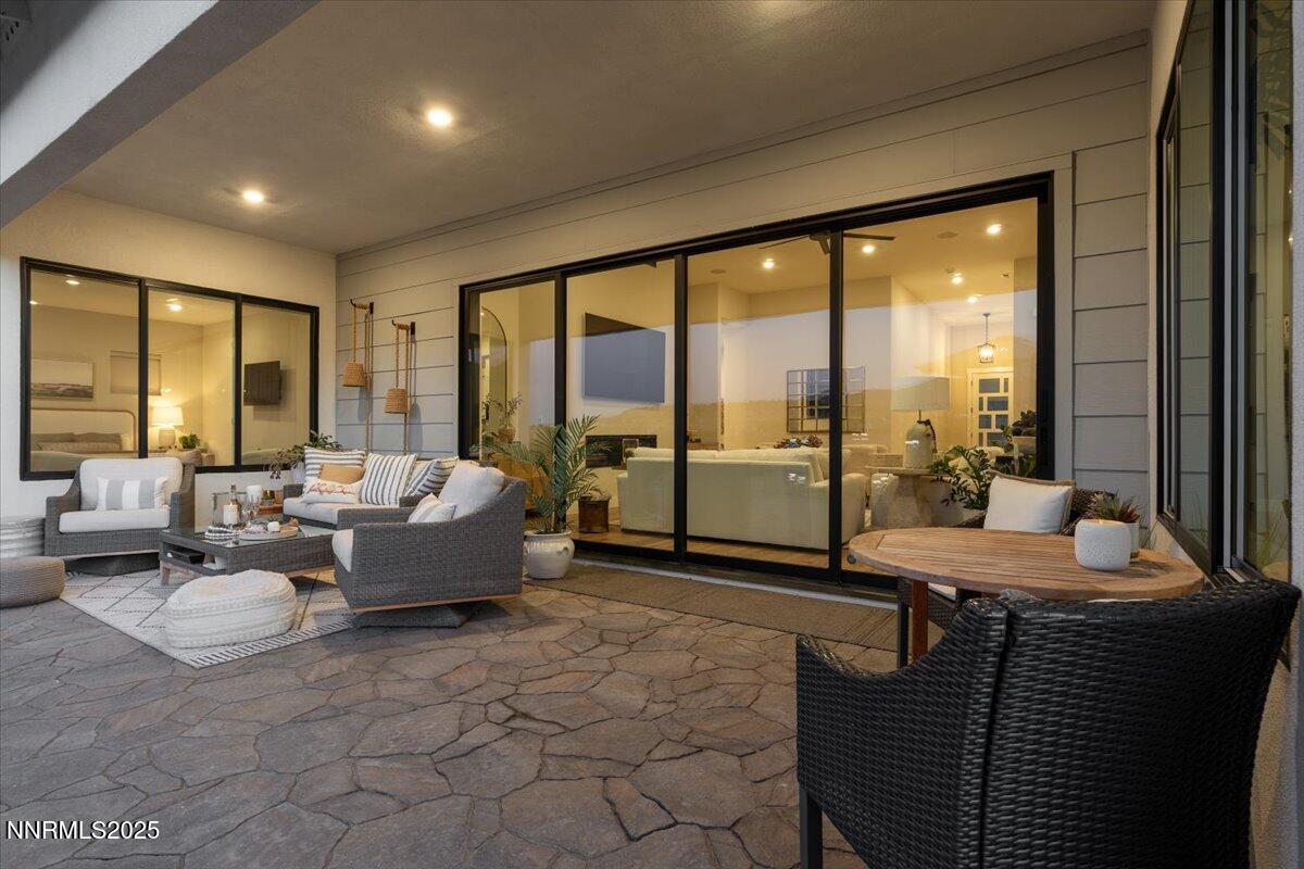 1593 River Hill Way Reno, NV 89523 - Photo 49 of 63 a living room with furniture and a floor to ceiling window