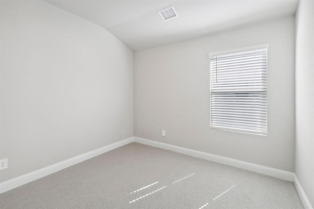 905 Buffalo Drive Lowry Crossing, TX 75407 - Photo 13 of 28 an empty room with a window