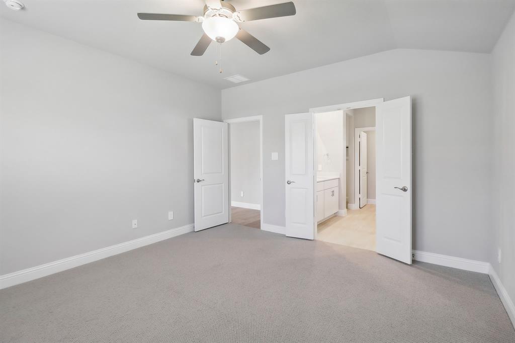 905 Buffalo Drive Lowry Crossing, TX 75407 - Photo 22 of 28 an empty room with chandelier fan