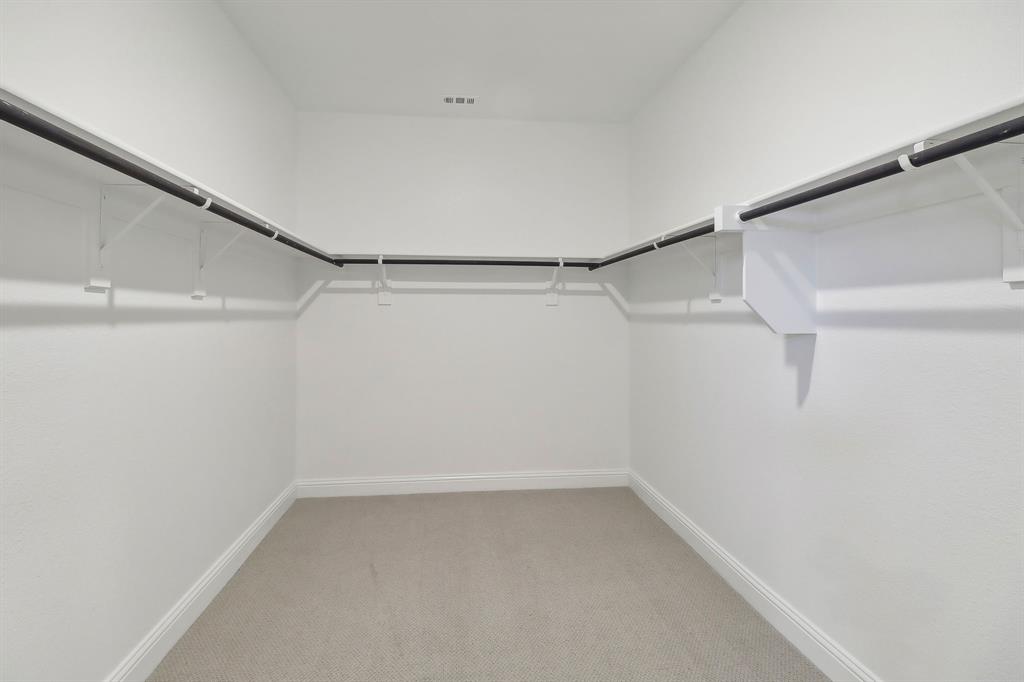 905 Buffalo Drive Lowry Crossing, TX 75407 - Photo 26 of 28 a view of a room with racks on the wall