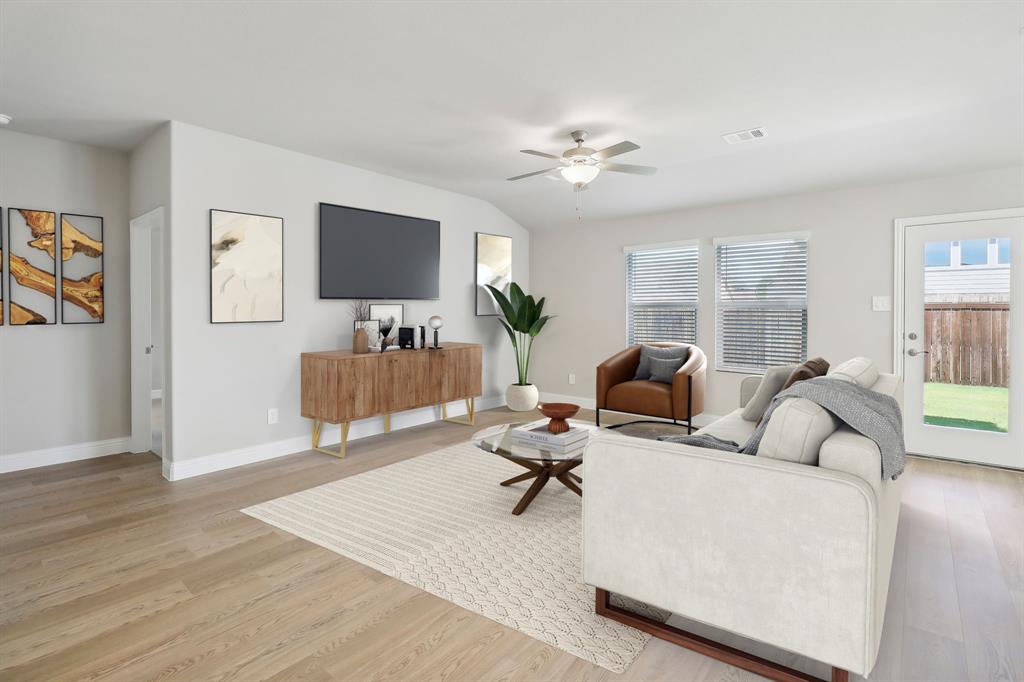 905 Buffalo Drive Lowry Crossing, TX 75407 - Photo 10 of 28 a living room with furniture and a flat screen tv