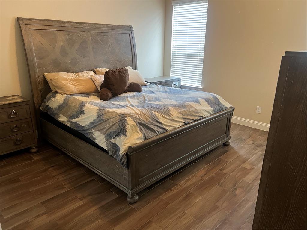 15608 Cornwallis Street Frisco, TX 75036 - Photo 11 of 23 a bed sitting in a bedroom next to a window